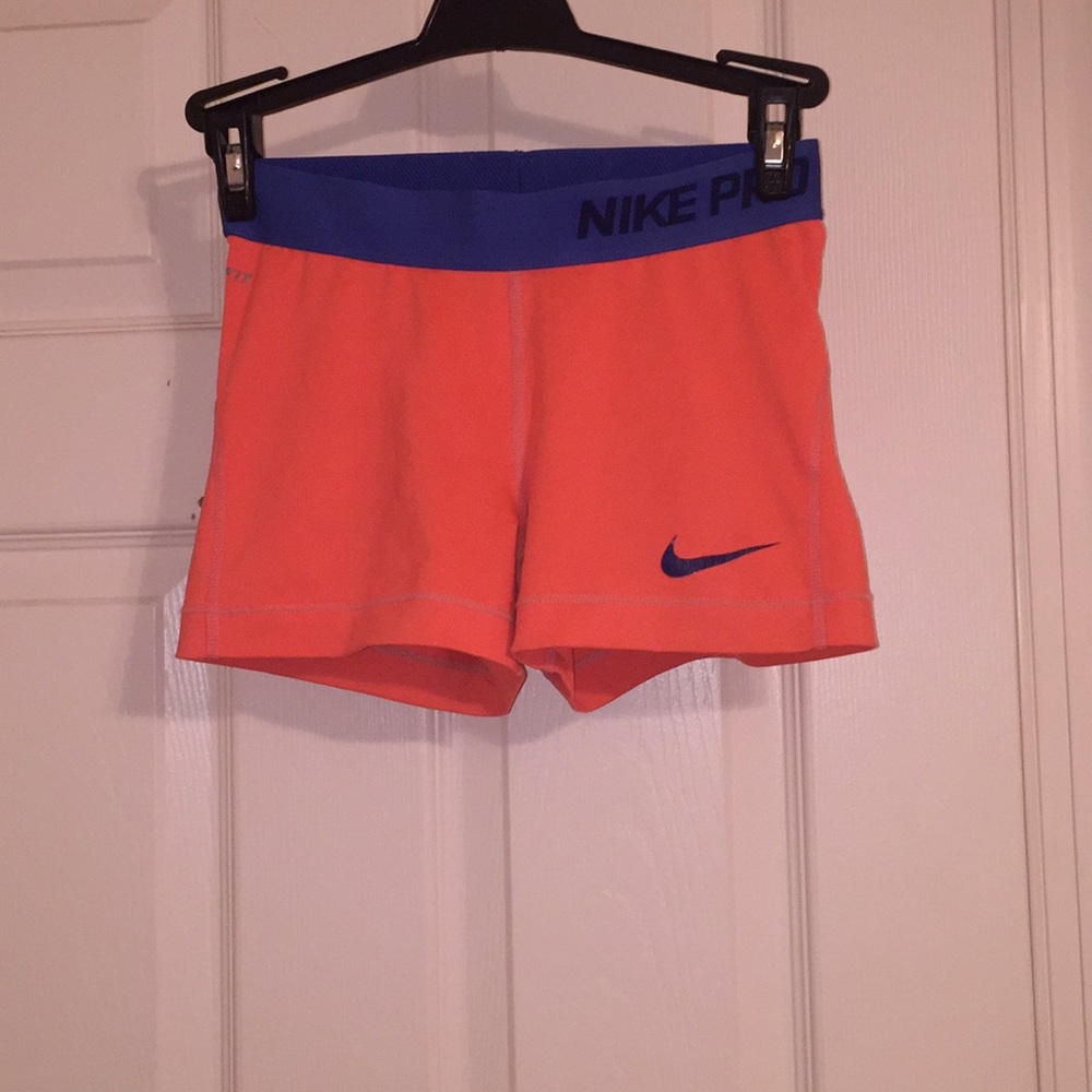 worn blue and orange nike pros